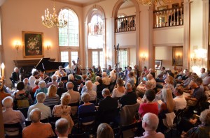 Patrons enjoy the concert in the Grand Parlor at the Ellison Bay Mansion 